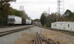 Shot of north end of Carrollton Yard with local cars on the west storage.  The one rapid discharge coal car is a bad order from Plant Wansley to the south.  Carrollton is primarily a coal feeder for two Georgia Power coal fired generating plants.